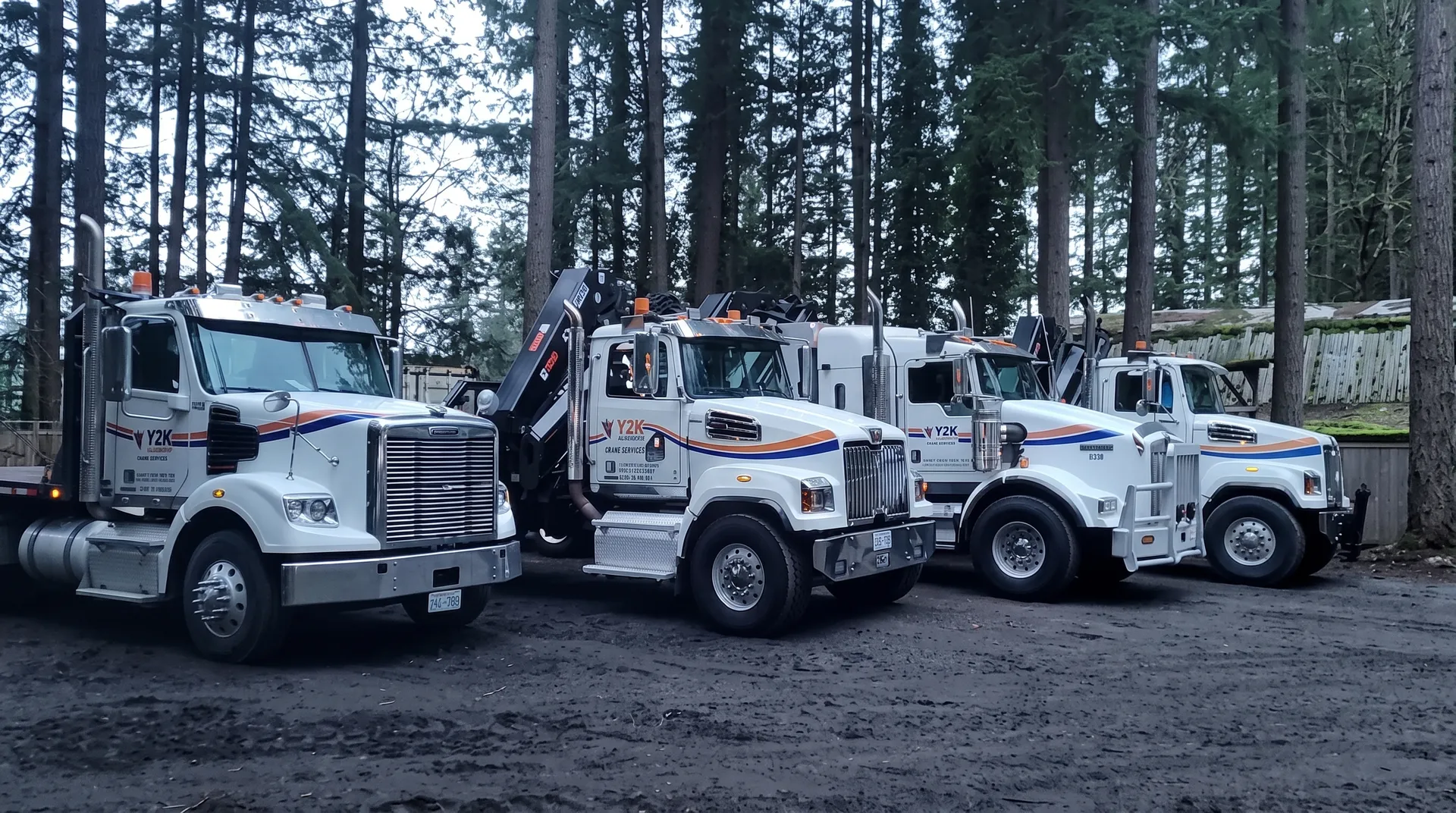 Y2K Transport crane trucks lined up at the Langley yard