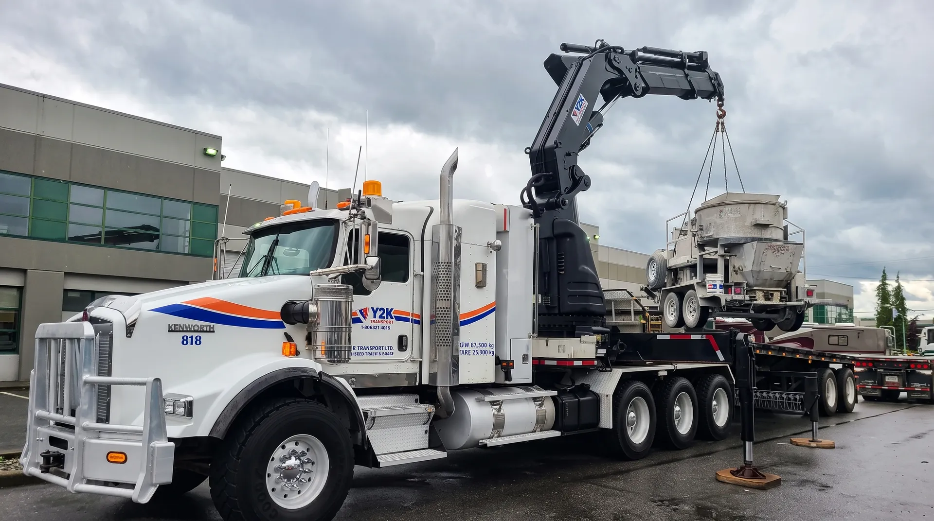 Y2K Transport crane truck lifting equipment on a commercial site